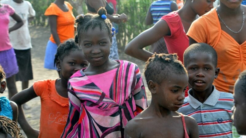 Haitian young girl smiling at the camera. Thank you!